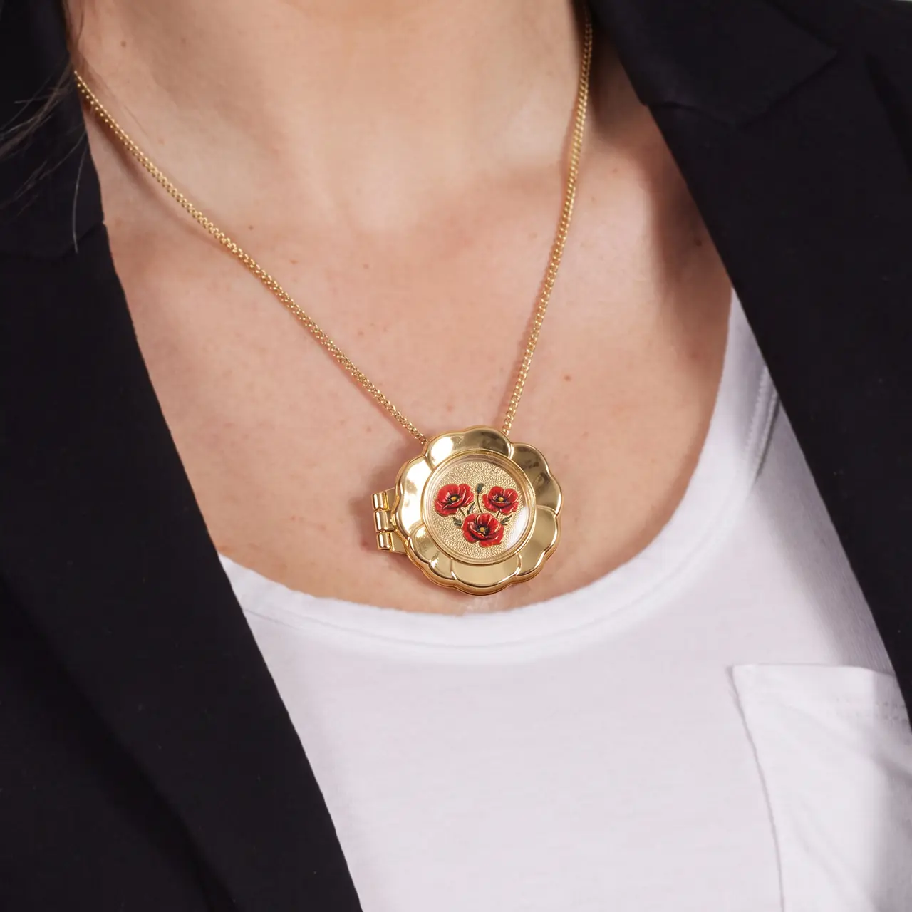 A young woman wearing the Forever Collection Remembrance Coin Locket Brooch with an Armistice 2-dollar coin